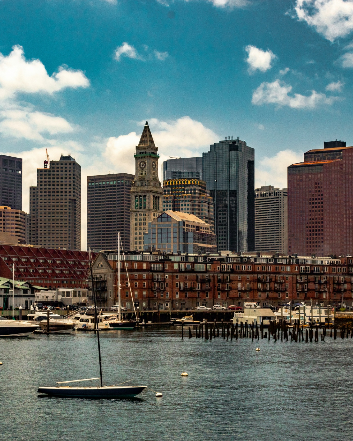 Boston Harbor with sailboats and the downtown skyline